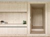 Built-in shelving crafted by local carpenters distinguish the living area from the service zone, where appliances and utilities are stored. Photo 5 of Sven Matt's Simple Gabled Home modern home