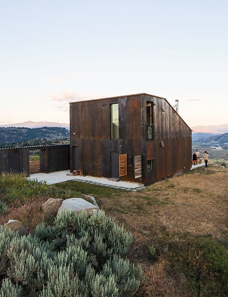 Architect Jesse Garlick&rsquo;s rural Washington vacation home references its rugged surroundings. The steel cladding has developed a patina similar to the ochre-red color of bedrock found in the area.