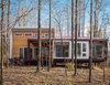 Architect German Brun and partner Lizmarie Esparza originally specified wood, but opted for the much less expensive material from James Hardie after contractor Damian Fitzpatrick recommended it. Photo 2 of Gordon Cabin modern home