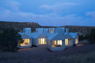 Constructed out of structural insulated panels (SIPS), the Element House is a modular building that was designed to operate independently of public utilities by instead employing passive systems and on-site energy generation. The house functions as a guesthouse and visitor center for Star Axis, a nearby land art project by the artist Charles Ross in New Mexico.