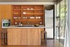By balancing the light from a variety of sources and ensuring that every corner was illuminated, Terry Ohm increased the feeling of expansiveness in the 12-and-a-half-by-14-foot kitchen. Photo of The Dwell Guide to Kitchen Design modern home