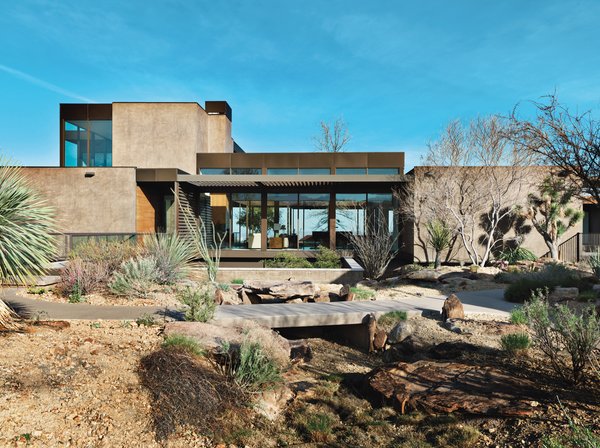 Embedded in the desert, this Marmol Radziner–designed prefab home for a Las Vegas casino executive features a James Turrell pyramidal Skyspace structure.  