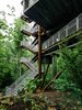 Modern home with Exterior and Treehouse Building Type. Mithun designed the tree house so that it would tread lightly on the land. The firm originally considered prefabricating the entire structure offsite but, in the research process, concluded that craning large modules into place would potentially harm the canopy. A combination of a bolted-together prefab structure and site-built wood housing yielded the least intrusive construction option.
The Summit Bechtel Reserve is located in West Virginia's coal mining country. The architects looked to the local structures—bridges, mining apparatus, and other industrial buildings—to inform the tree house's design. A 166-ton Cor-Ten steel megastructure supports the 125-foot-tall building. The use of regionally appropriate materials, like steel and black locust wood, was important to the architects. Photo 3 of Sustainability Treehouse
