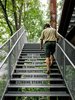Modern home with Exterior and Treehouse Building Type. Visitors scale a series of outdoor staircases that wind their way up the structure. Volume and Studio Terpeluk turned the risers into a teaching moment about energy use and the impact of every day activities. Photo 4 of Sustainability Treehouse