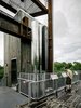 At the structure's top, a 4,000-watt wind turbine and 6,500-watt photovoltaic array offers lessons about renewable energy. Photo 5 of Sustainability Treehouse modern home