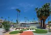Modern home with Exterior, Mid-Century Building Type, House Building Type, and Butterfly RoofLine. Krisel was also known for his boldly modern approach to landscape. The Menrad residence, shown here, features a distinct geometric design. The architect, working in the harsh Palm Springs climate, relied on hardscape elements—setting a precedent for drought-tolerant landscape design. Photo of Midcentury Lovers: You Can Thank This Architect for Transforming Palm Springs Into a Modernist Hotbed
