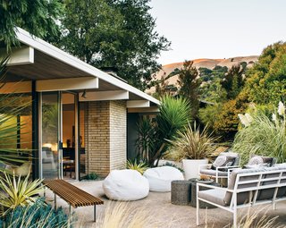 The beanbag chairs and outdoor sofa and chairs are from West Elm and the Case Study Museum Bench is from Modernica.