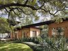 Modern home with Exterior, House Building Type, Wood Siding Material, and Flat RoofLine. Porches and rolling glass doors draw in the river breeze to keep the home cool. Photo 6 of Hog Pen Creek