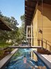 Modern home with Outdoor, Swimming Pools, Tubs, Shower, Lap Pools, Tubs, Shower, Concrete Pools, Tubs, Shower, and Back Yard. “The owners envisioned a place that engaged with the outdoors while providing accommodating spaces for their off-season training for triathlons,” Flato notes. A 75-foot-long lap pool on the west end of the home comes in handy during practice. Photo 8 of Hog Pen Creek