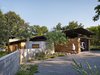 Modern home with Garage and Detached Garage Room Type. A Renlita Floataway garage door is shielded by one of the home’s many overhangs. Photo 9 of Hog Pen Creek