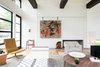 Rice faced the same challenge of creating modern yet family-friendly interiors. He settled on a warm, muted palette with lots of texture. The space features a mix of comfortable seating with more unique, collectible pieces — like the Jean Prouvé daybed or Vincent van Duysen chairs by the window. "I wanted the space to feel like a home rather than a museum,” Rice says. Photo 4 of Preston Hollow modern home