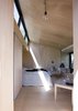 Copenhagen-based architect Martin Kallesø was tasked with a simple program: create a freestanding guest room so that visitors have a private place to lay their heads. The interior is small, but comfortable. It fits a double bed, coffee table, and chair. The bed is recessed into the wall so as not to waste any space. Photo of Unique Ways to Design with Recessed Space modern home