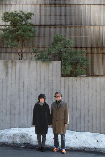 Architect Byoung-soo Cho and his wife, Eunsil Kim, value the privacy, and style, 

that a concrete wall and recycled Indonesian teak facade provide.