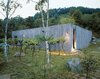 Modern home with Exterior, Concrete Siding Material, Flat RoofLine, House Building Type, and Cabin Building Type. Cho’s recently completed vacation retreat, the Concrete Box House, was inspired by the use of raw materials. Cho decided on grape vines as an unusual landscape element. Photo of Architect Spotlight: Byoung-soo Cho
