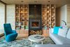 Modern home with Living Room, Standard Layout Fireplace, Chair, Gas Burning Fireplace, Coffee Tables, Sectional, and Light Hardwood Floor. A sofa from Design Within Reach opposes a Hi Turn chair by Bensen in the living room. Photo 3 of San Juan Islands Residence