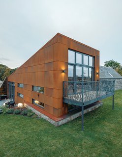 Surprisingly, this cozy and partially earth-sheltered family home—which is, according to Gavin, "one step away from Passive House standards"—started life as a series of derelict and semi- derelict farmstead buildings in raw and rural Aberdeenshire, in the hinterland of Scotland’s northeast coast. For the new structure, Grace & Webb fabricated a laser-cut steel balcony.