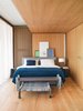 Modern home with Bedroom, Bed, and Light Hardwood Floor. The cozy bedroom is clad in oiled oak. Photo of This Berlin Apartment Manages to Be Totally Adorable in Only 900 Square Feet