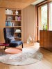 Modern home with Living Room, Chair, Coffee Tables, Console Tables, Medium Hardwood Floor, and Rug Floor. Light filters through the apartment from both the east and west sides. The coffee tables are by Bruzkus Batek for komdo.co. Kim Layani designed the rugs. Photo of This Berlin Apartment Manages to Be Totally Adorable in Only 900 Square Feet