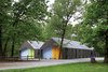 Modern home with Shed & Studio. The two-tone corrugated metal cladding helps the sheds blend into the landscape, along with windows custom-colored by the manufacturer to match. Photo by Mike Sinclair. Photo of 16 Funky Facades
