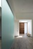 Modern home with Hallway. A frosted-glass partition separates the living spaces. Photo of Designing for Privacy: 14 Discreet Uses For Frosted Glass