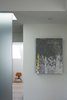 Modern home with Hallway. A natural daylight shines down the partition, imparting an ethereal glow. Photo of Designing for Privacy: 14 Discreet Uses For Frosted Glass
