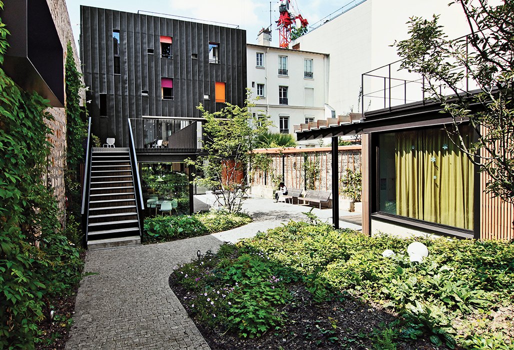 Architect Damien Brambilla turned a run-down Paris apartment building into an open, bright adolescent group home with a landscaped garden.