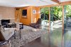 Like many of Wright's Los Angeles designs, the property prioritizes indoor/outdoor connection and rich materials including cypress paneling and Brazilian walnut tile flooring. Photo 2 of Warwick Evans House modern home