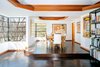 The elevated dining area room looks out onto the half-acre site. In recent years, the house has been restored. Photo 3 of Warwick Evans House modern home