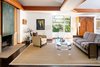 The fireplace is copper. The architect's thoughtful use of natural materials is a technique passed down from his father, Frank Lloyd Wright. Photo 6 of Warwick Evans House modern home