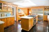 The kitchen is one area of the house that's been updated. The floors are ipe, and the appliances are by Wolf and Sub-Zero. Photo 7 of Warwick Evans House modern home