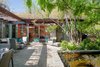 The house wraps around the patio and koi pond. Photo 8 of Warwick Evans House modern home