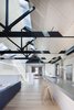 “The fact that the external walls were built to the site’s boundary led to the solution of skylights as the one of the few means of introducing north light and good cross ventilation into the building,” Simpson continues. The hanging lights are from Artemide while the hotplates and cooktops are from Barazza. Photo 3 of Water Factory modern home