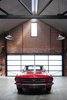 Modern home with Garage. The owners are car collectors, especially of “vintage American Mustangs,” Simpson says, so a nearly 23-foot-wide garage door opening was created at the rear of the building to access a space made for six prized rides. Photo 9 of Water Factory