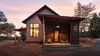 Modern home with Exterior, House Building Type, and Cabin Building Type. A Seattle family tasked Atmosphere Design Build with creating a sustainable dwelling in Nevada City, California, the matriarch's hometown and a historic mining community. The firm's material-driven approach channels the pioneer spirit of the gold rush, without compromising comfort or high-efficiency standards. Photo of Don't Let Its Rustic Charm Fool You, This Net-Zero Home Plays for Team Modern