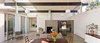The interior palette is simple, with concrete floors and plaster ceilings. The fireplace, made of stacked Roman brick, is another design move commonly seen in midcentury houses. Photo of If Eichler Designed a House Today, This Is What It Might Look Like modern home
