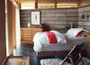 Modern home with Bedroom, Bed, and Chair. In the bedroom, a Margaret Kilgallen print joins a Brionvega Algol television, lamps from Patricia Urquiola and Pablo, and a Hans Wegner chair. Photo of 17 Modern Homes With Hans Wegner Furniture