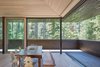 Imported Tyrolean dining chairs and a custom bench designed by Lexie pair well with the family’s antique leaf table under the Douglas Fir ceiling. Photo of Here's What Norse Mythology and Modern Architecture Have in Common modern home