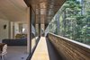 Beyond the open-air living and dining rooms, the master bedroom is also accessible by the shaded patio. The living room features a B&B Tufty-Too sectional sofa and two Bensen U-Turn chairs. Photo of Here's What Norse Mythology and Modern Architecture Have in Common modern home