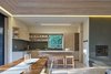The open-plan kitchen serves the family’s needs for easy entertaining. The four bar stools are also custom designed by Lexie and were built by Yvonne Mouser. Photo of Here's What Norse Mythology and Modern Architecture Have in Common modern home