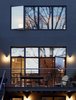 The rear facade is a surprisingly modern counterpoint to the traditional front. Here, traditional brick is traded for modern stucco. Photo of It's Back to Basics for This 1901 Brooklyn Town House modern home