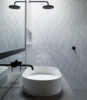 White tile and black fixtures form a striking contrast in another bath. Photo of 50+ Modern Tile Ideas for Walls, Floors and Ceilings modern home