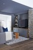 Walker carried the aquatic color palette over to the new den, which sits just off of the kitchen-dining area. Photo of Hard to Believe This Home Dates Back to the 1820s modern home