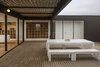 “The program of enclosures was developed around a courtyard that is protected from the constant wind. The transparency of the main facade brings the presence of the sea inside the house,” LLaumett says. Photo 5 of Unplugged modern home