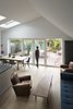 The more subdued parquet flooring from Emois et Bois spreads across the dining and living rooms. Photo 7 of Wisteria Residence modern home