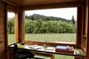 When she visits the Watershed, Kathleen's writing accoutrements are limited to paper and pencil. Photo of Inside 5 Tiny Homes, All Under 600 Feet modern home