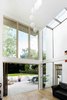 The home's defining quality is its airy, double-height spaces. Photo 4 of Wrap House modern home