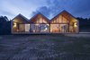 Modern home with Exterior and Wood Siding Material. Looking into the warm, brightly lit house at night offers a different kind of view, one that charmingly recalls the cutaway dioramas in Wes Anderson’s films. Photo 7 of Lookout House