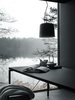 Modern home with Dining Room, Table, and Pendant Lighting. Vipp's prefab Shelter requires a delivery time of six months and costs $585,000. Pricing includes interior fittings, all by Vipp, including bathroom vanity, lighting, leather daybed, kitchen island, dining table (pictured), bedding, storage, and even kitchen utensils. Photo of Prefab Gets a Makeover With Danish Industrial Design