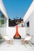 Modern home with Outdoor and Small Patio, Porch, Deck. Armed with a keen eye for design and a yen for vintage furniture shopping, Glee star Jayma Mays and actor Adam Campbell revitalize a formerly jumbled Los Angeles house. On an outdoor deck space, the couple placed their fire engine red fireplace, found at the Rose Bowl Flea Market. Photo of Cozy Fireplaces