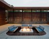 “We didn’t want the pit to be an obtrusive contraption sitting in the center of a zen-like courtyard,” says architect Matthew Hufft. A low-profile fire pit is the perfect continuation of a mellow Missouri backyard. Photo by Mike Sinclair. Photo of Creative Modern Porches and Decks modern home